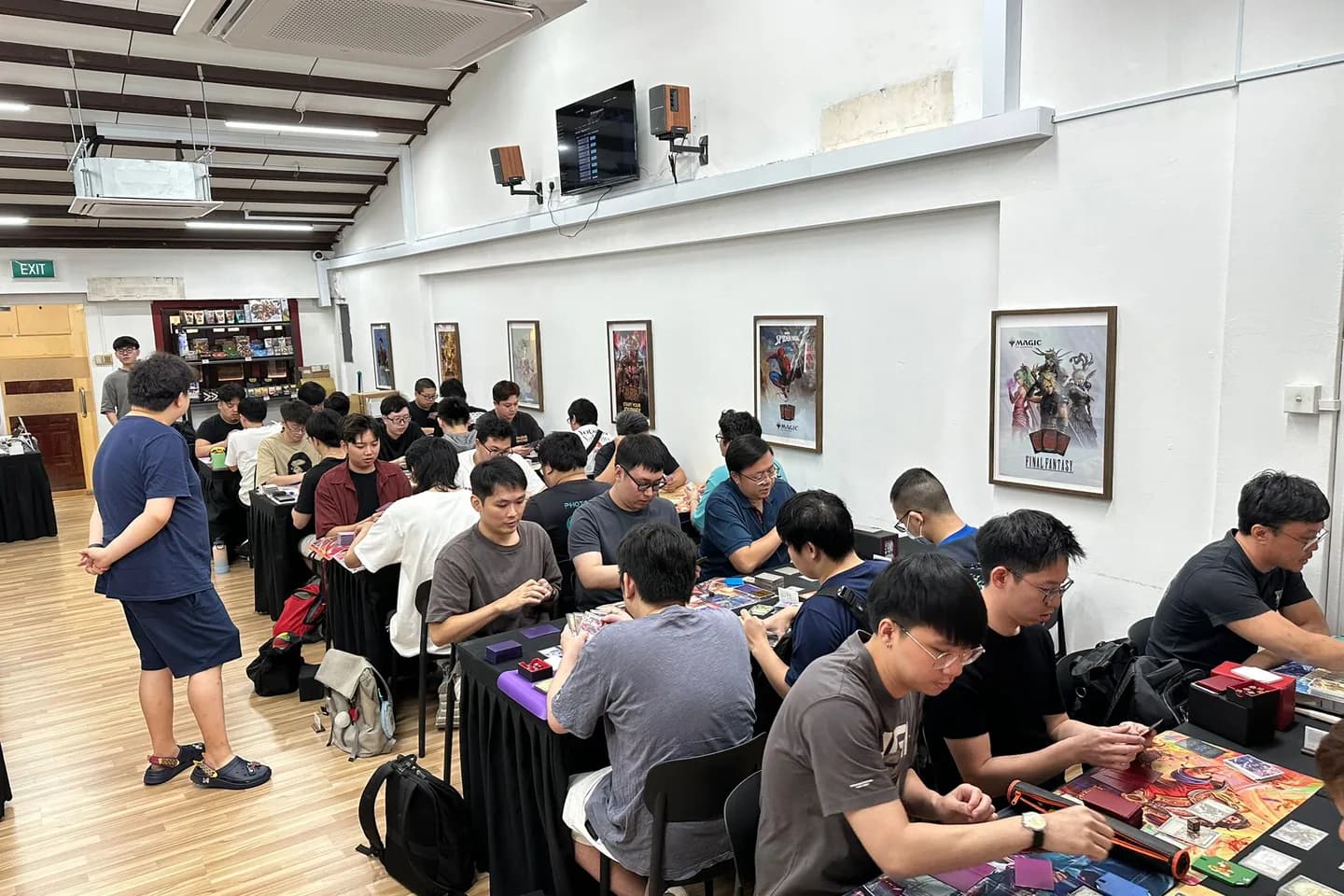 Wide view of a full community event at Cards Central.